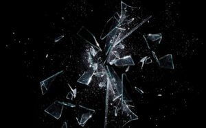 glass breaking with black background